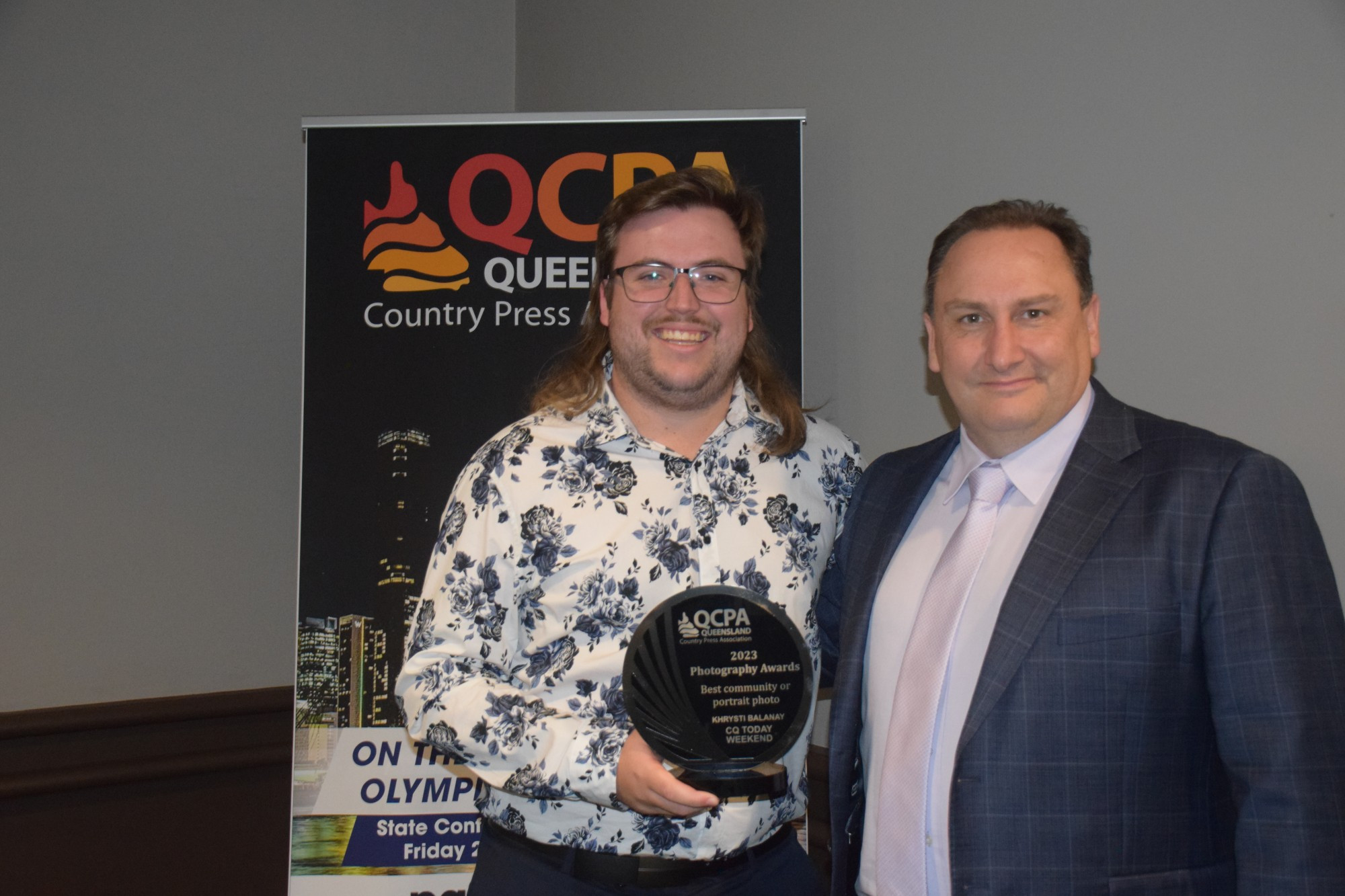 winner-best-community-or-portrait-picture-cq-today-weekend-khrysti-balanay-with-lucas-white-from-potent-presenting-trophy.jpg