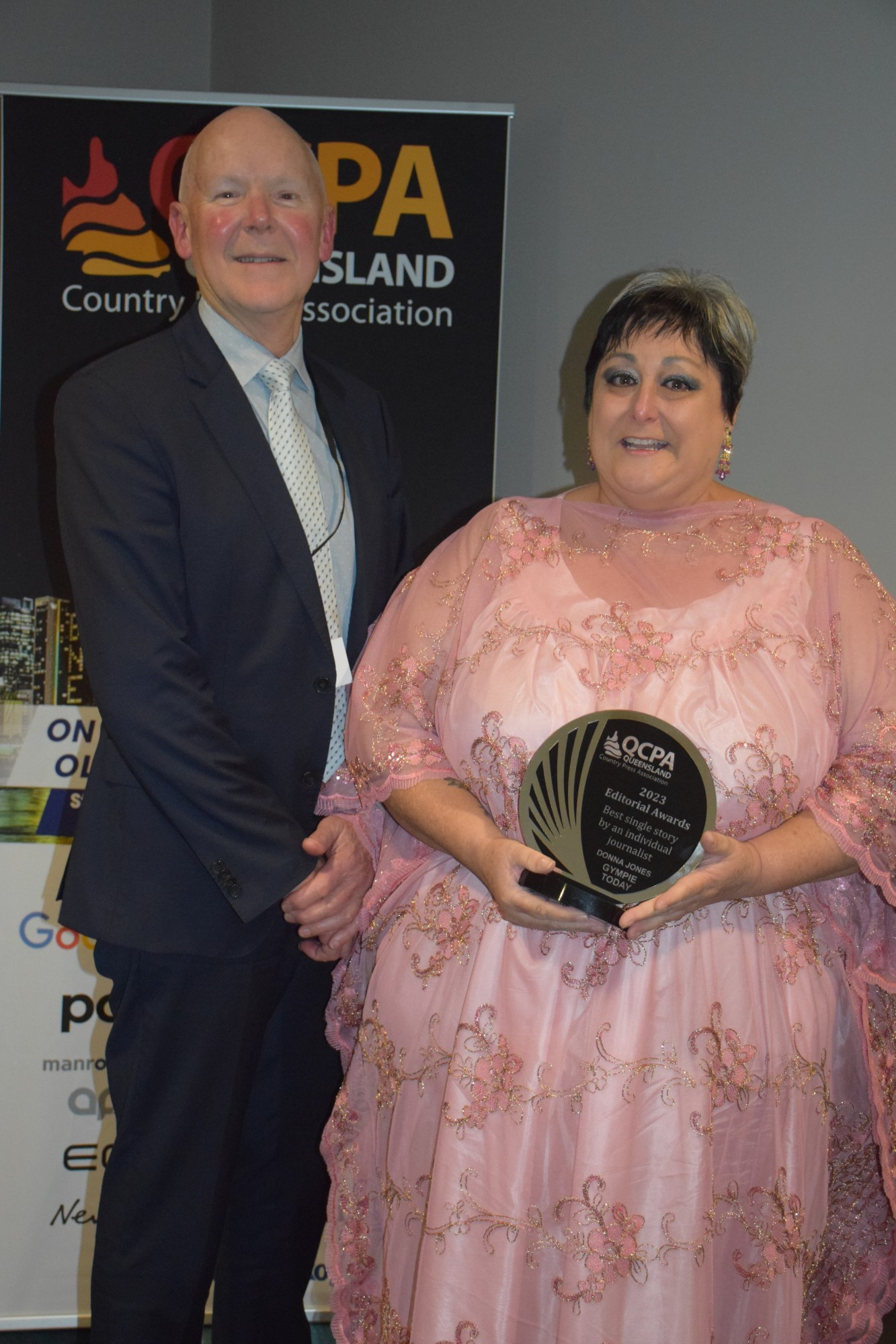 winner-best-single-story-by-an-individual-journalist-gympie-today-donna-jones-receiving-trophy-from-bruce-ellen-today-print.jpg