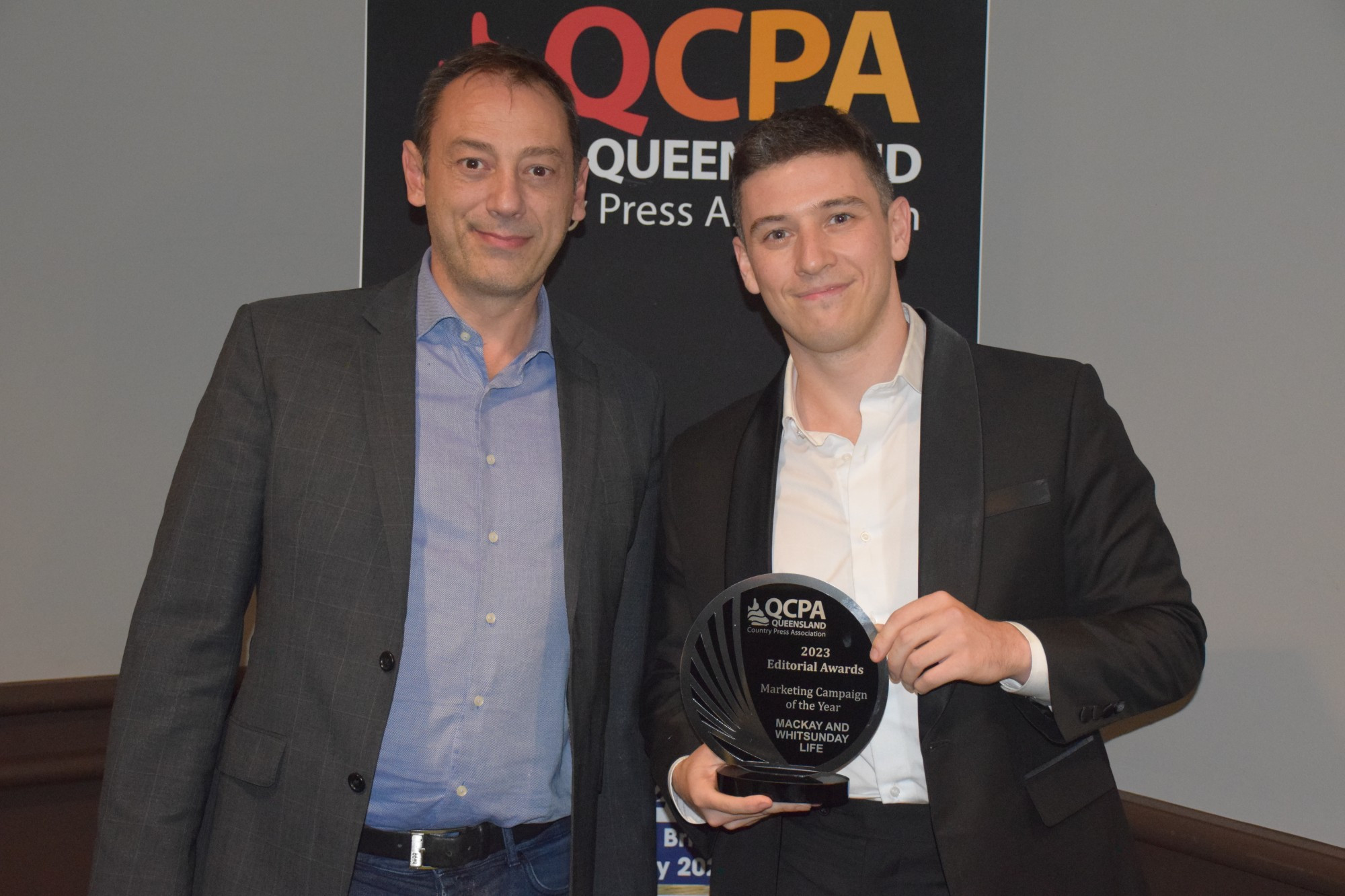 winner-marketing-campaign-of-the-year—mackay-and-whitsunday-life-michael-mccann-receives-trophy-from-john-georgantzakos-spot-press.jpg