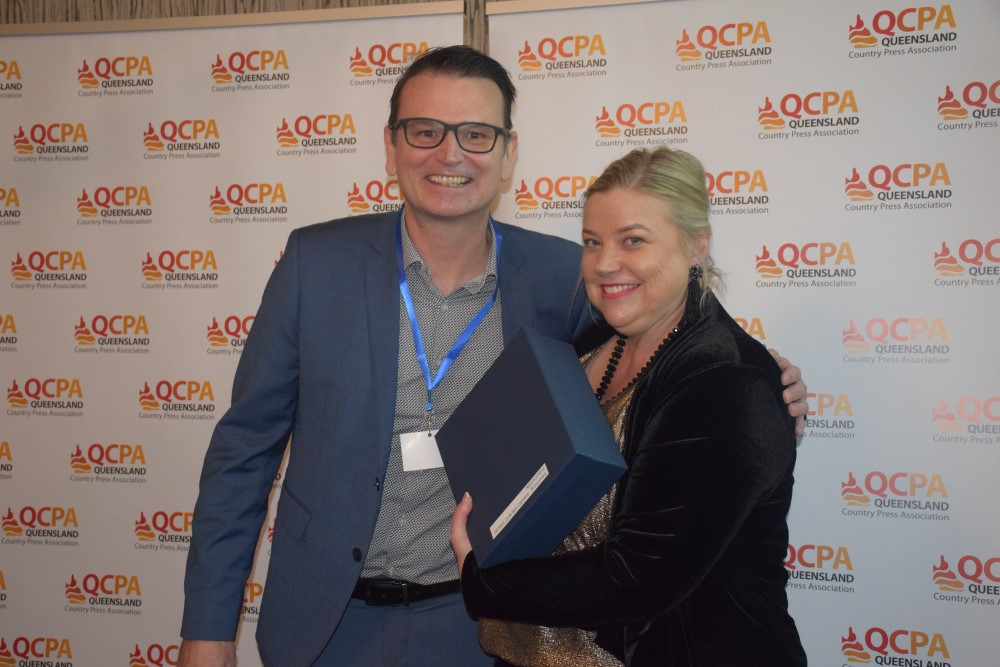 Michael Newell, News Ltd Australia presents winning trophy to Ingrid Barham, Bundaberg Today