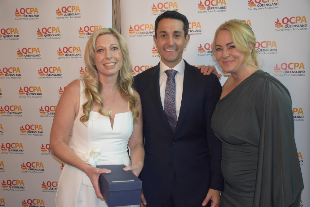 Hon David Crisafulli MP presents winning trophy to Rachael Smith and Rebecca Douthwaite, Mackay & Whitsunday Life