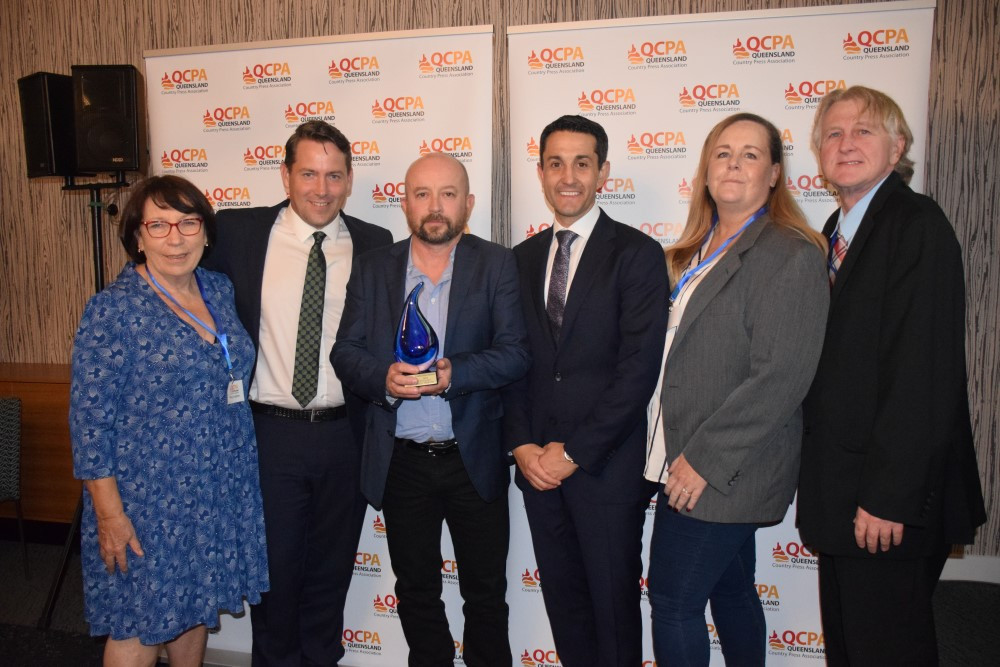 The winning Ipswich Tribune team Wendy Creighton, Drew Creighton, Rob Mellett, Lara Hart and David Lems presented with their trophy by Hon David Crisafulli MP
